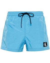 Calvin Klein - Logo-patch Swimming Shorts - Lyst