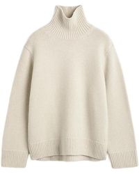 TOTEME - Oversized Lambswool Turtleneck Sweater Almond - Lyst