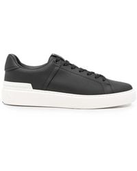 Balmain - Logo-Embossed Lace-Up Sneakers - Lyst