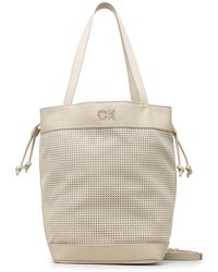 Calvin Klein - Handtasche re-lock drawstring bag perf k60k610635 stoney beige pea - Lyst