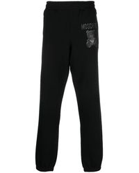 Moschino - Pantalon de jogging en coton biologique à logo imprimé - Lyst