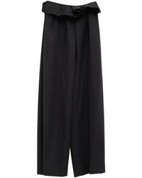 KHAITE - Kira Ruffled Pleated Trousers - Lyst