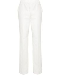 Moschino - Patch-detail Cotton Trousers - Lyst