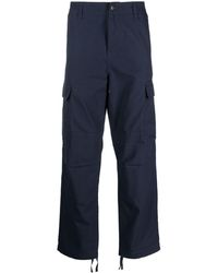 Carhartt - Pantalones rectos con bolsillos tipo cargo - Lyst