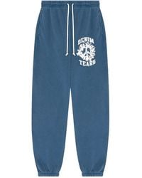DENIM TEARS - Pantalones de chándal University con logo - Lyst