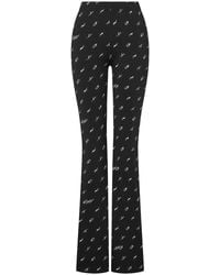 Moschino - Printed Flared Trousers - Lyst