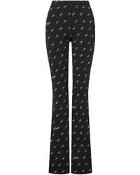 Moschino - Printed Flared Trousers - Lyst