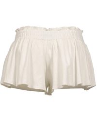 GLOWNY - Honey Ruffled Pointelle-Knit Mini Shorts - Lyst