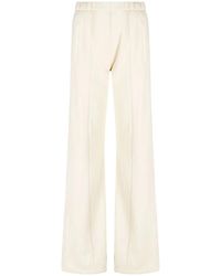 Amiri - Flared-Leg Jersey Trousers - Lyst