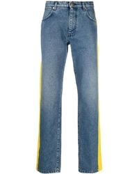 Moschino - Logo-Print Slim-Cut Jeans - Lyst