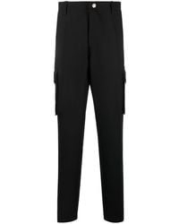 Versace - Pantalon droit en laine à poches cargo - Lyst