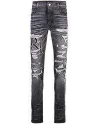 Amiri - staggered Skinny Jeans - Lyst