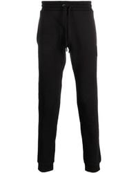 Moncler - Pantalones de chándal con parche del logo - Lyst