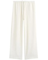 TOTEME - Drawstring Striped Trousers - Lyst