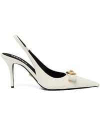 Versace - Pointed Toe Slingback Heels With Textured Bow And Medallion - Lyst