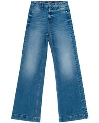 HTC - Stonewashed Flared Jeans - Lyst