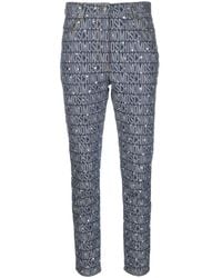 Moschino - Monogram-Print Skinny Jeans - Lyst
