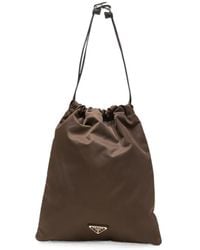 Prada - Logo-Plaque Drawstring Tote Bag - Lyst