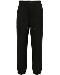 Versace - V-emblem Tapered Trousers - Lyst