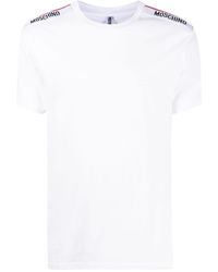 Moschino - T-Shirt mit Logo-Streifen - Lyst