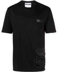 Moschino - Ribgebreid T-shirt Met Logo-reliëf - Lyst