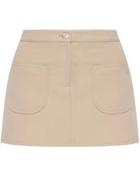 Courreges - Minifalda con aplique del logo de sarga - Lyst