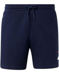Reebok - Pantalones cortos de deporte con logo estampado - Lyst