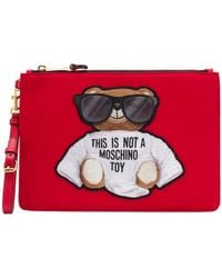 Moschino - Teddy Embroidered Logo Clutch Bag - Lyst