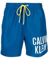 Calvin Klein Short de bain à logo imprimé - Bleu