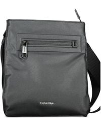 Calvin Klein - Logo-Print Zip-Pocket Messenger Bag - Lyst