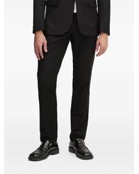Guess - Pantaloni Con Placca Logo - Lyst