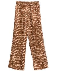 Lee Mathews - Logo-Pattern Trousers - Lyst