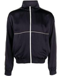 Saint Laurent - Teddy Trainingsjacke aus glänzendem Jersey mit Paspeln - Lyst
