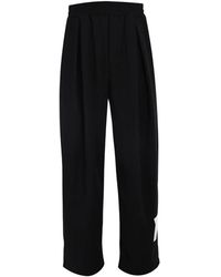 Tee Library - Rip-Off Pleated Logo-Patch Trousers - Lyst