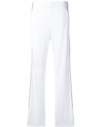 women's black track pants with white stripe