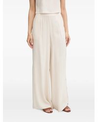 Guess - Logo-Patch Wide-Leg Trousers - Lyst