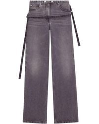 Courreges - One Strap Stonewashed Mid-rise Jeans - Lyst