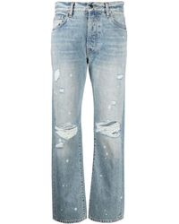 Amiri Jeans mit Farbklecks-Print - Blau