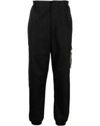 Moschino - Tapered Stretch-cotton Trousers - Lyst