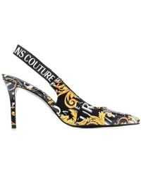Versace - Zapatos de tacón con tira trasera y logo - Lyst
