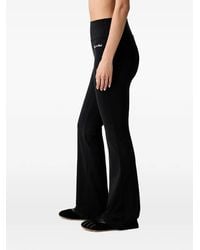 Sporty & Rich - Logo-Print Flared Leggings - Lyst