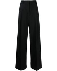 Burberry - Pantaloni sartoriali neri ampi con pieghe - Lyst