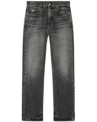 Versace - Jeans With Logo Appliqué - Lyst