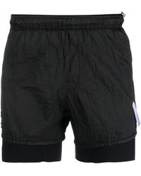 Satisfy - Pantalones cortos de running a capas - Lyst