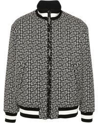 Balmain - Wendbare bomberjacke schwarz weiß marine monogramm - Lyst