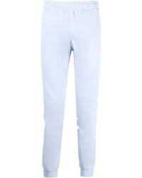 adidas - Pantalones de chándal con rayas laterales - Lyst