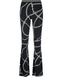 Versace - Chain-print Flared Trousers - Lyst