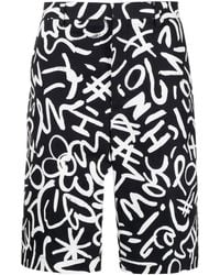 Moschino - Chino-Shorts mit Monogramm-Print - Lyst
