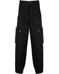 MSGM - Contrasting-stitch Logo-patch Trousers - Lyst