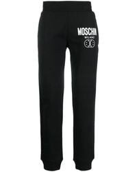 Moschino - Logo-Print Cotton Track Trousers - Lyst